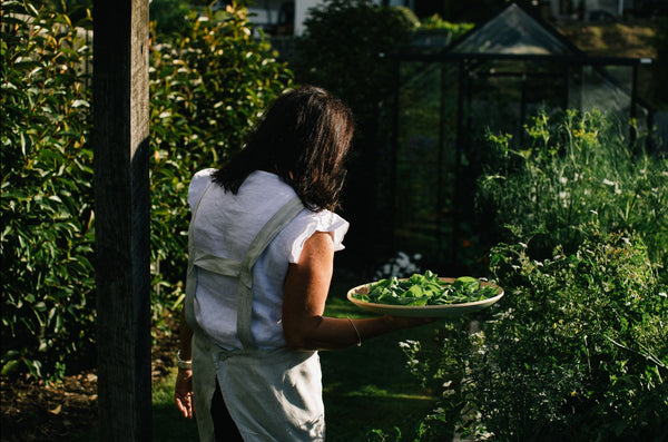 Anna Hiatt in the garden with a salad